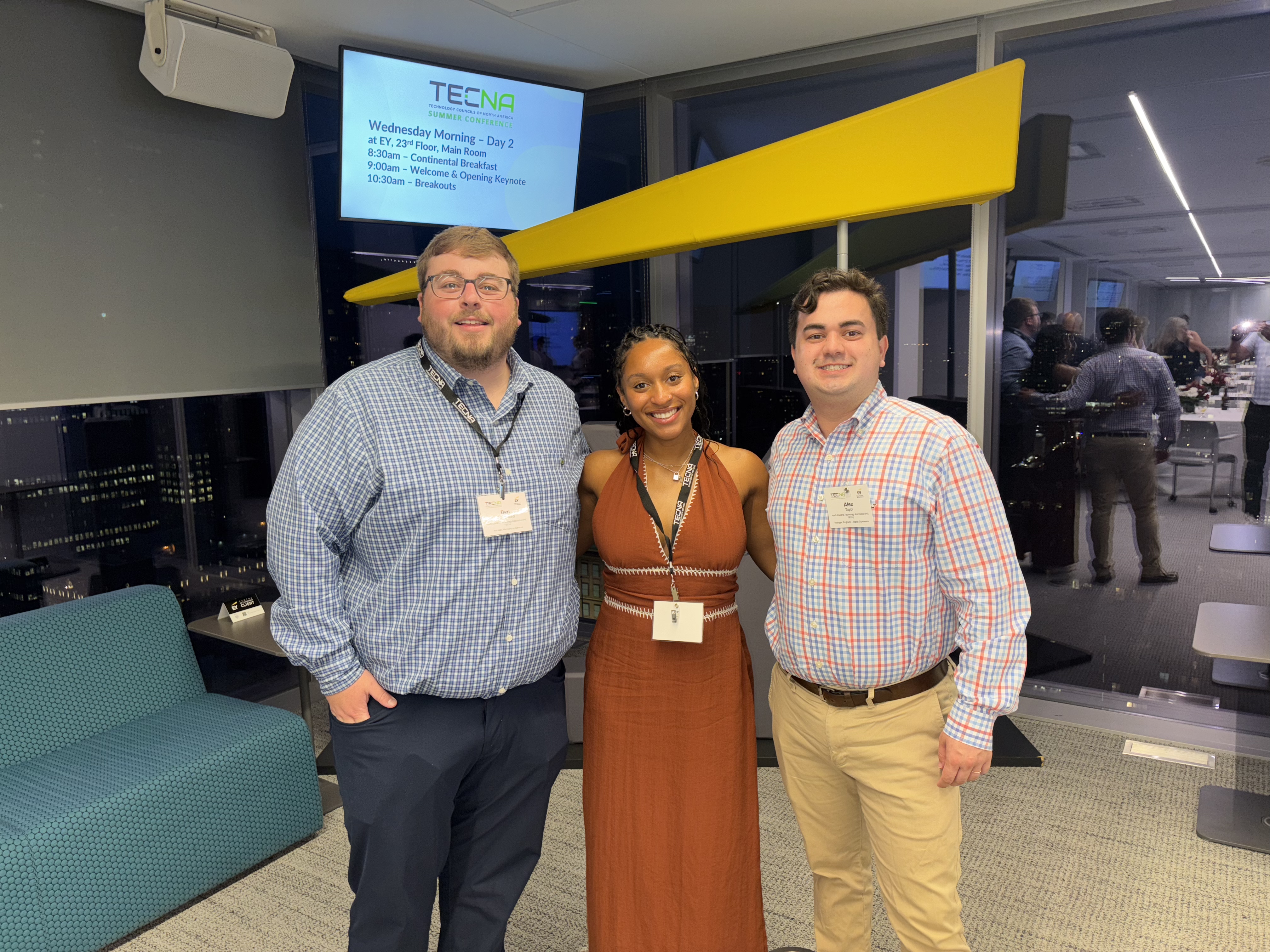 3 team members standing together smiling at the camera